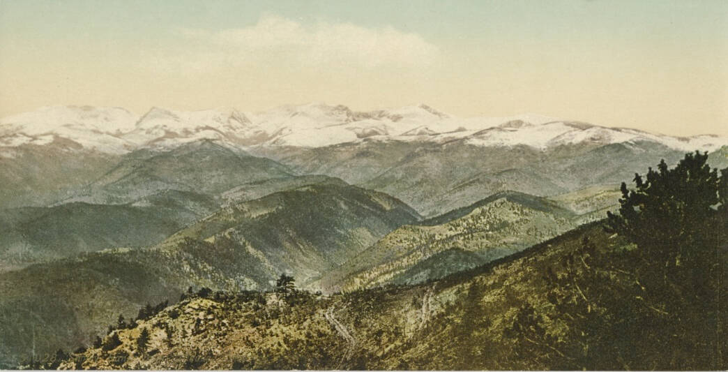 Color photographic postcard of a mountain scene.